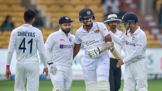 Bengaluru: Indian players greet Sri Lanka's Suranga Lakmal as he announces his retirement from test cricket during the third day of 2nd test cricket match between India and Sri Lanka at Chinnaswamy Stadium, in Bengaluru, Monday, March 14, 2022. (PTI Photo/Shailendra Bhojak)(PTI03_14_2022_000272B)(PTI)