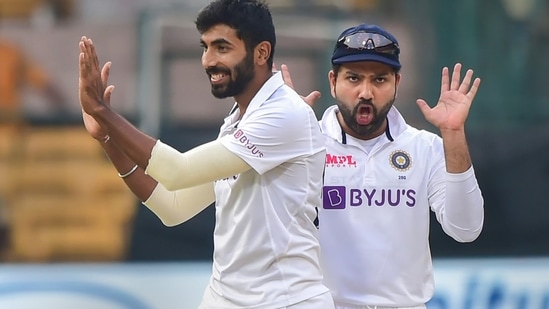 Bengaluru: India's Jasprit Bumrah with skipper Rohit Sharma celebrates the wicket of Sri Lanka's skipper Dimuth Karunaratne during the third day of 2nd test cricket match between India and Sri Lanka at Chinnaswamy Stadium, in Bengaluru, Monday, March 14, 2022. (PTI Photo/Shailendra Bhojak)(PTI03_14_2022_000274A)(PTI)