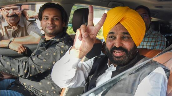 AAP leader and Punjab CM-elect Bhagwant Mann flashes victory sign after submitting his resignation as a member of Parliament, in New Delhi, on Monday. (PTI)