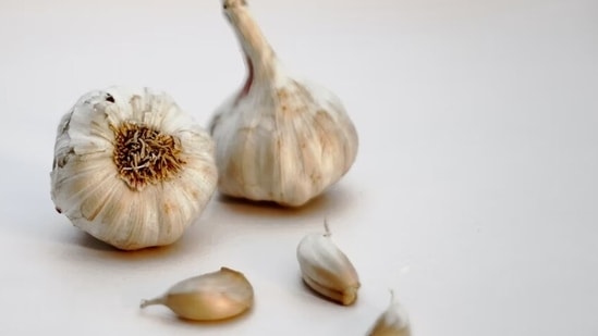 Garlic: Selenium, an enzyme found in garlic helps one to enhance sperm motility.(Unsplash)