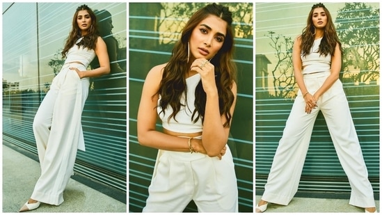 Pooja Hegde also made heads turn in a white crop top and high-rise white trousers teamed with pumps.(Instagram/@hegdepooja)