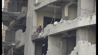 Around 300 workers are currently working at the site to drill 7,000 holes of about two metres each in one of the towers for inserting the shock tubes, officials said. (Sunil Ghosh /HT) Around 300 workers are currently working at the site to drill 7,000 holes of about two metres each in one of the towers for inserting the shock tubes, officials said. (Sunil Ghosh /HT)