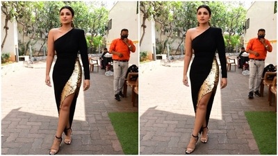 Parineeti Chopra has lately been the talk of the town for her wardrobe choices for the show Hunarbaaz. From stylish Western wear to gorgeous Indian attire, the Ishaqzaade actor is pulling off every outfit effortlessly with poise. For the latest episode, Parineeti donned a black and golden asymmetrical body-hugging dress. (HT Photo/Varinder Chawla) Parineeti Chopra has lately been the talk of the town for her wardrobe choices for the show Hunarbaaz. From stylish Western wear to gorgeous Indian attire, the Ishaqzaade actor is pulling off every outfit effortlessly with poise. For the latest episode, Parineeti donned a black and golden asymmetrical body-hugging dress. (HT Photo/Varinder Chawla)