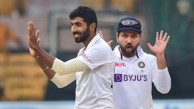 India's Jasprit Bumrah with skipper Rohit Sharma celebrates the wicket of Sri Lanka's skipper Dimuth Karunaratne during the third day of 2nd test cricket match between India and Sri Lanka at Chinnaswamy Stadium (PTI)