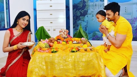 Amrita Rao with husband RJ Anmol and son Veer during a puja.&nbsp;