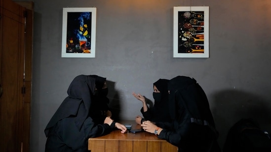 Indian Muslim students spend time at a cafe after they were denied entry into their college for wearing the hijab in Udupi, Karnataka state, India, Feb. 24, 2022. (AP Photo/Aijaz Rahi)(AP)