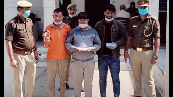 The three suspects in police custody on Monday. (Sourced)