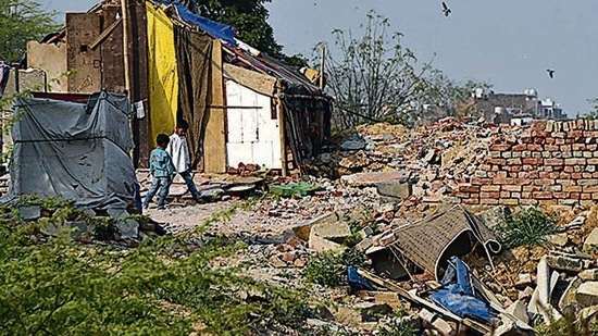 Within months of the demolition of the Khori village in Faridabad, hundreds of people have returned to set up temporary jhuggis in the hope of resettling on this forest land, in Faridabad, India, (Photo by Sanjeev Verma/Hindustan Times)