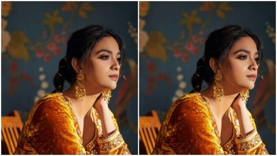 In gold jhumkas from the house of Amrapali Jewels, Keerthy aced the ethnic look to perfection. She wore her tresses into a clean braid and decorated it with golden threads.(Instagram/@keerthysureshofficial)