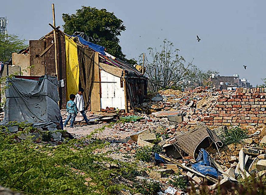 Within months of the demolition of the Khori village in Faridabad, hundreds of people have returned to set up temporary jhuggis in the hope of resettling on this forest land, in Faridabad, India, (Photo by Sanjeev Verma/Hindustan Times)