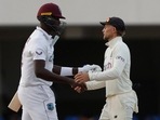 West Indies' Jason Holder shakes hands with England's Joe Root after a draw.