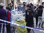 Residents have their swab samples taken at a makeshift nucleic acid testing site, following the coronavirus disease (COVID-19) outbreak in Shanghai, China.