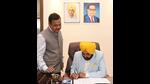 Bhagwant Mann assuming charge as the Punjab chief minister in Chandigarh on Wednesday as A Venu Prasad, the additional chief secretary to the CM, looks on. (HT Photo) Bhagwant Mann assuming charge as the Punjab chief minister in Chandigarh on Wednesday as A Venu Prasad, the additional chief secretary to the CM, looks on. (HT Photo)