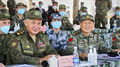 Russian Defense Minister Sergei Shoigu (left) and Chinese Defense Minister Wei Fenghe watch a joint military exercise by Russia and China held in the Ningxia Hui Autonomous Region in northwestern China on August 13, 2021. (AP/FILE) Russian Defense Minister Sergei Shoigu (left) and Chinese Defense Minister Wei Fenghe watch a joint military exercise by Russia and China held in the Ningxia Hui Autonomous Region in northwestern China on August 13, 2021. (AP/FILE)