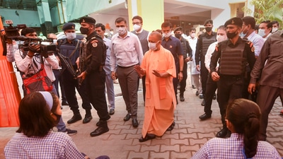 Uttar Pradesh Chief Minister Yogi Aditiyanath arrives to inspect the vaccination drive for the age group 12-14 years (PTI) Uttar Pradesh Chief Minister Yogi Aditiyanath arrives to inspect the vaccination drive for the age group 12-14 years (PTI)