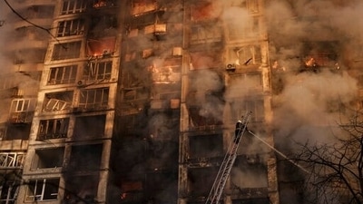 Firefighters extinguish flames in an apartment building after being hit by shelling in Kyiv, Ukraine. (AP) Firefighters extinguish flames in an apartment building after being hit by shelling in Kyiv, Ukraine. (AP)