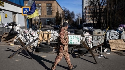 A flag of Ukraine is displayed at a military check point in the center of Kyiv on March 15, 2022, on the 20th day of the Russian invasion of Ukraine. (AFP)