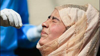 A health worker collects swab samples for COVID-19 testing in Jammu. (PTI Photo) A health worker collects swab samples for COVID-19 testing in Jammu. (PTI Photo)