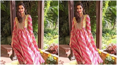 Diana paired a pink and gold kurta with intricate multicoloured prints with a pair of pink and gold printed cotton trousers with wide legs. (Instagram/@dianapenty)