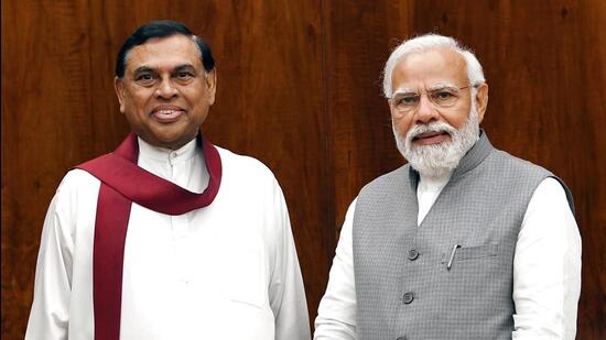 Prime Minister Narendra Modi meets with Sri Lankan finance minister Basil Rajapaksa, in New Delhi on Wednesday. (ANI)