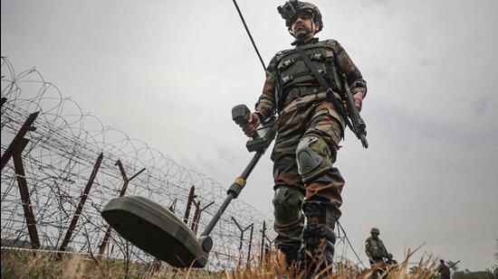 Indian Army soldiers patrol near the Line of Control in Akhnoor sector of J&K. (PTI Photo)