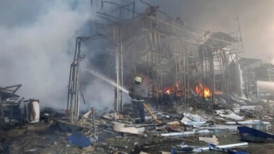 Firefighters work to extinguish a fire at a market hit by shelling in Kharkiv, Ukraine, Wednesday.(AP) Firefighters work to extinguish a fire at a market hit by shelling in Kharkiv, Ukraine, Wednesday.(AP)