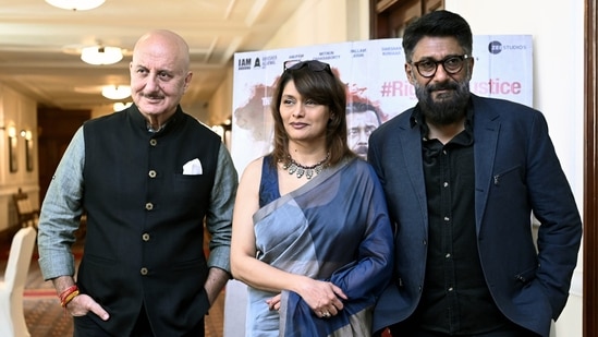 Bollywood actor Anupam Kher, producer Pallavi Joshi, director Vivek Agnihotri pose for a picture at a press conference regarding the movie The Kashmir Files.(Mohd Zakir)