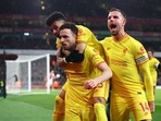 Liverpool's Diogo Jota celebrates scoring their first goal with Luis Diaz and Jordan Henderson.