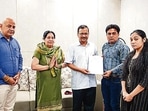 Delhi chief minister handed over the government job certificate to Ankur Sharma, brother of IB employee Ankit Sharma, who lost his life in Delhi riots. They have been posted in the Education Department of Delhi Government, in New Delhi, India, on Thursday, March 17, 2022. (HT Photo) Delhi chief minister handed over the government job certificate to Ankur Sharma, brother of IB employee Ankit Sharma, who lost his life in Delhi riots. They have been posted in the Education Department of Delhi Government, in New Delhi, India, on Thursday, March 17, 2022. (HT Photo)