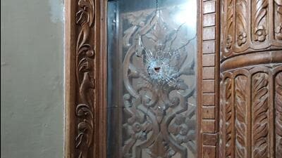A windowpane damaged by a bullet at the victim’s house in Harmilap Nagar, Baltana, Zirakpur. (HT Photo) A windowpane damaged by a bullet at the victim’s house in Harmilap Nagar, Baltana, Zirakpur. (HT Photo)