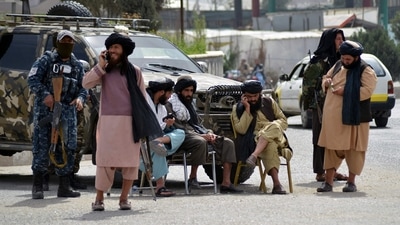 Members of the Taliban man a road checkpoint in Kandahar. (AFP)