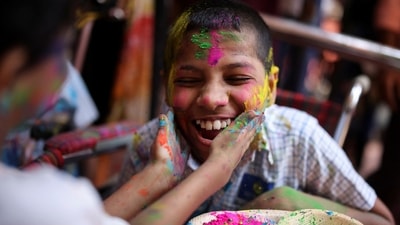 Differently-abled children cover each other in coloured powder during Holi celebrations at a school in Mumbai. (REUTERS)