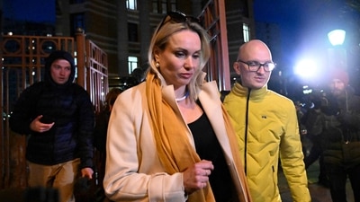 Marina Ovsyannikova, the editor at the state broadcaster Channel One who protested against Russian military action in Ukraine during the evening news broadcast at the station late Monday, leaves the Ostankinsky District Court after being fined for 30,000 rubles ($280, 247 euros) for breaching protest laws in Moscow. (AFP) Marina Ovsyannikova, the editor at the state broadcaster Channel One who protested against Russian military action in Ukraine during the evening news broadcast at the station late Monday, leaves the Ostankinsky District Court after being fined for 30,000 rubles ($280, 247 euros) for breaching protest laws in Moscow. (AFP)