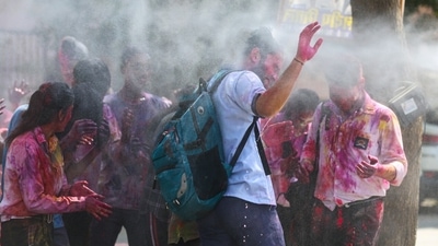 Students play with colours outside their school in New Delhi ahead of the upcoming festival of Holi. (HT Photo/Sanchit Khanna)