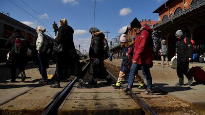 Refugees walk across train tracks to board a train to Bucharest at Suceava station after fleeing Ukraine, following Russia's invasion of Ukraine last month. (Image used for representation). (REUTERS PHOTO.)