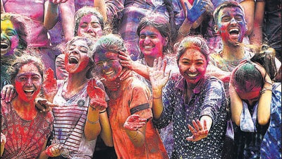 Students celebrating Holi at Panjab University in Chandigarh on the festival’s eve on Thursday. Additional police force has been deployed in the tricity ahead of the festivities to keep traffic violators and rowdy elements in check. (Keshav Singh/HT)