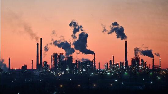 A general view shows a local oil refinery during sunset in Omsk, Russia March 16, 2022. (REUTERS/Alexey Malgavko)