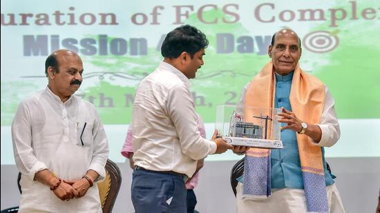 Union defence minister Rajnath Singh being presented a memento by DRDO chairman G Satheesh Reddy during the inauguration of the seven-storey technical facility in Bengaluru on Wednesday. (PTI)