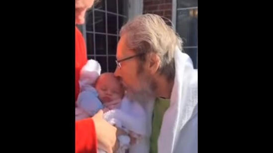 Screengrab from the Instagram video that shows the first meeting of a grandpa and his new-born granddaughter.&nbsp;(instagram/@goodnewscorrespondent)