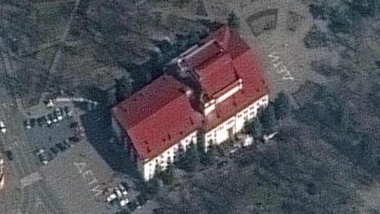 Satellite image shows closer view of Mariupol Drama Theatre before bombing, as a word "children" in Russian is written in large white letters on the pavement in front of and behind the building. Picture taken March 14, 2022. Satellite image ©2022 Maxar Technologies/Handout via REUTERS(via REUTERS)