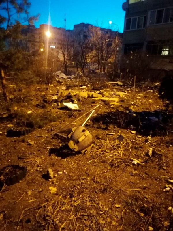 Debris lies scattered on the ground after the remains of a downed missile damaged a residential building in Kyiv on March 17, 2022.&nbsp; (via Reuters)