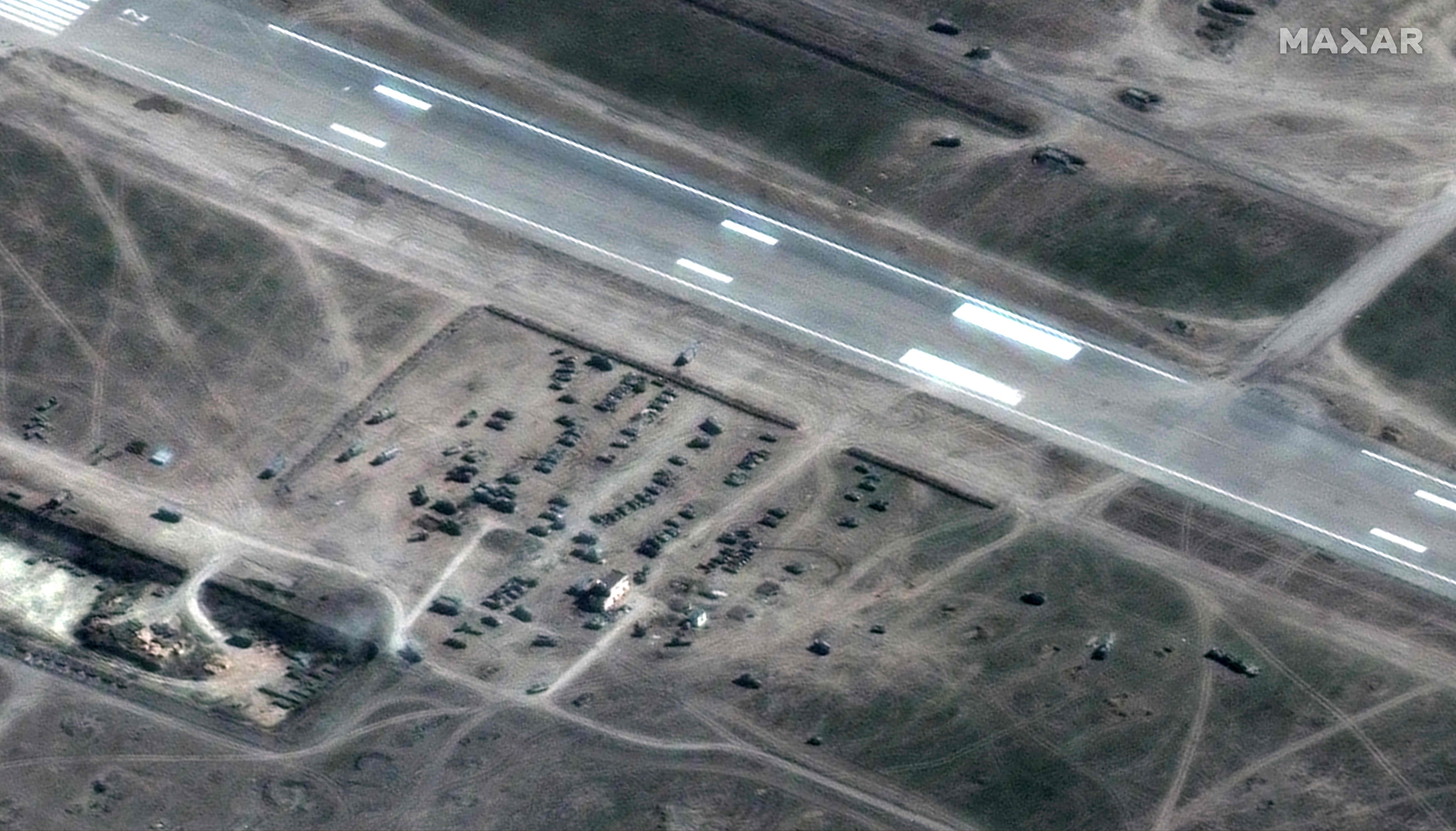 This Maxar satellite image taken and released on March 16, 2022 shows a Russian ground forces deployment near the runway at Kherson Airfield, Kherson, Ukraine. (Maxar Technologies / AFP)