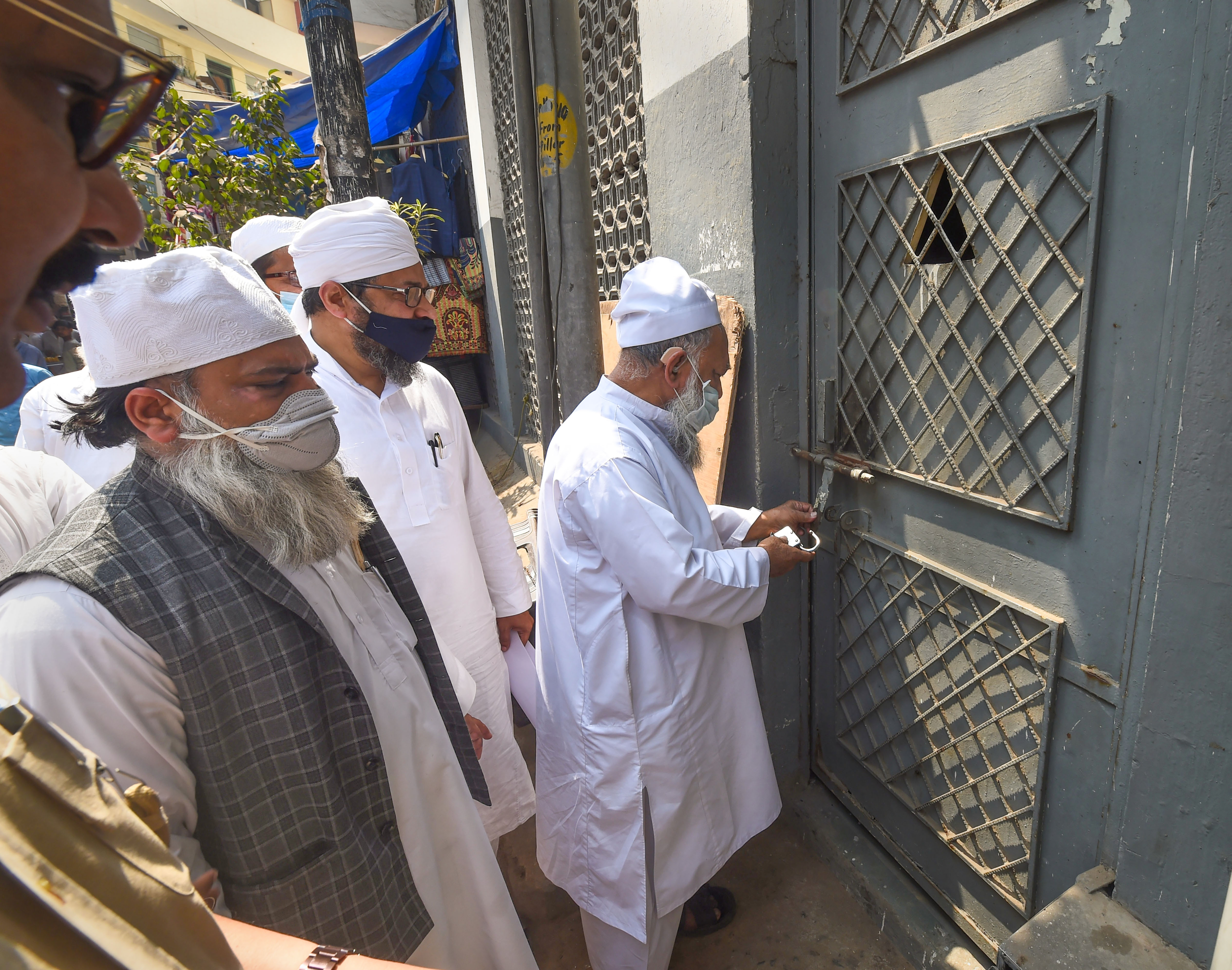 Committee members enter Nizamuddin Markaz after its reopening, to offer prayers during Shab-e-Barat in New Delhi, Thursday, March 17, 2022. (PTI Photo/ Shahbaz Khan)