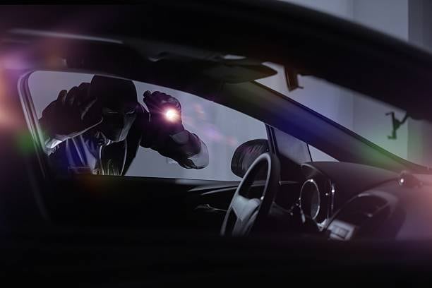 Car thief with a flash light. (iStockPhoto: Photo for representational purposes) Car thief with a flash light. (iStockPhoto: Photo for representational purposes)
