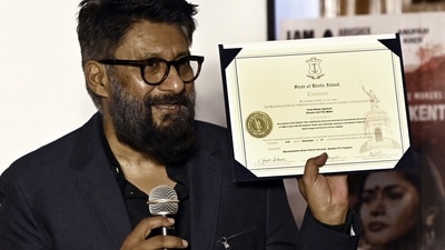 New Delhi, Mar 14 (ANI): Director Vivek Agnihotri shows a Citation issued by the United States (US) state 'Rhode Island' during a press conference regarding his movie 'The Kashmir Files', &nbsp;(ANI Photo) (Mohd Zakir)
