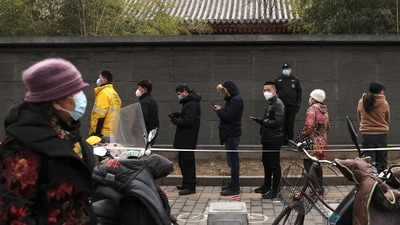 Residents line up for nucleic acid testing, following the coronavirus disease (COVID-19) outbreak, in Beijing, China on Friday. (REUTERS)