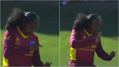 Afy Fletcher pretends to video-call her seven-month-old son after dismissing Bangaldesh's Fargana Hoque. (Instagram/ICC)