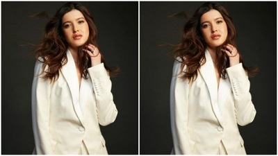 Shanaya paired a white oversized blazer lined with white buttons with a pair of white formal trousers with wide legs. (Instagram/@shanayakapoor02)