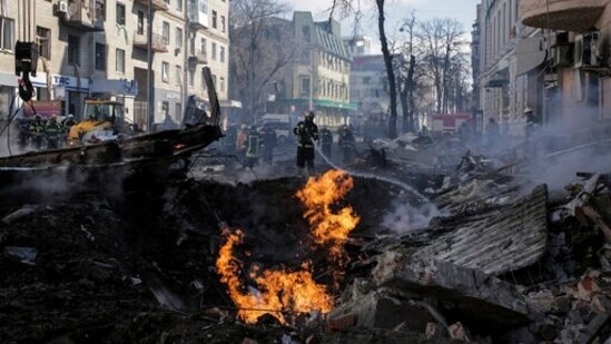 Firefighters extinguish a fire after a Russian rocket attack in Kharkiv, Ukraine's second-largest city, Monday, March 14, 2022. (AP Photo/Pavel Dorogoy, File)(AP)