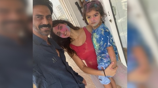 Gabriella Demetriades celebrated Holi with her beau Arjun Rampal and their son Arik Rampal. She captioned her post, "Arik taking Holi very seriously as you can see in the last slide . Happy holi everyone #holilove."(Instagram/@gabriellademetriades)